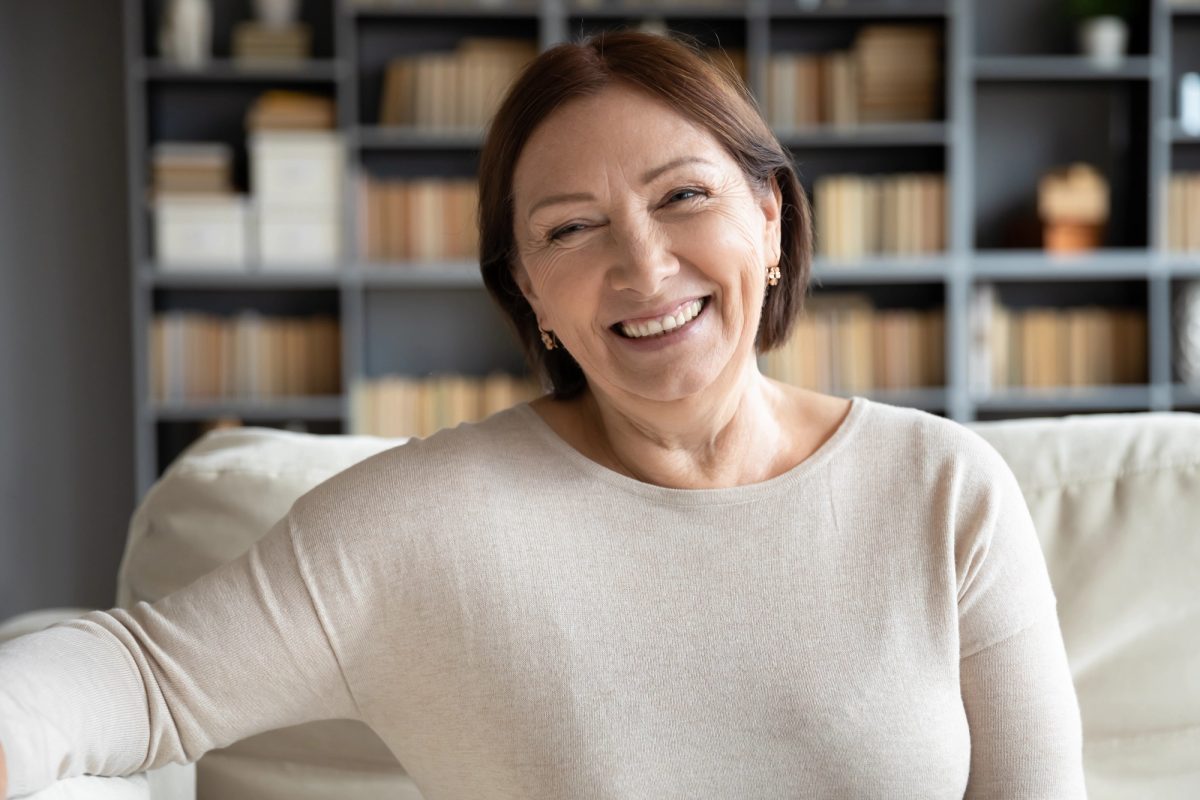 A patient smiling in a comfortable setting
